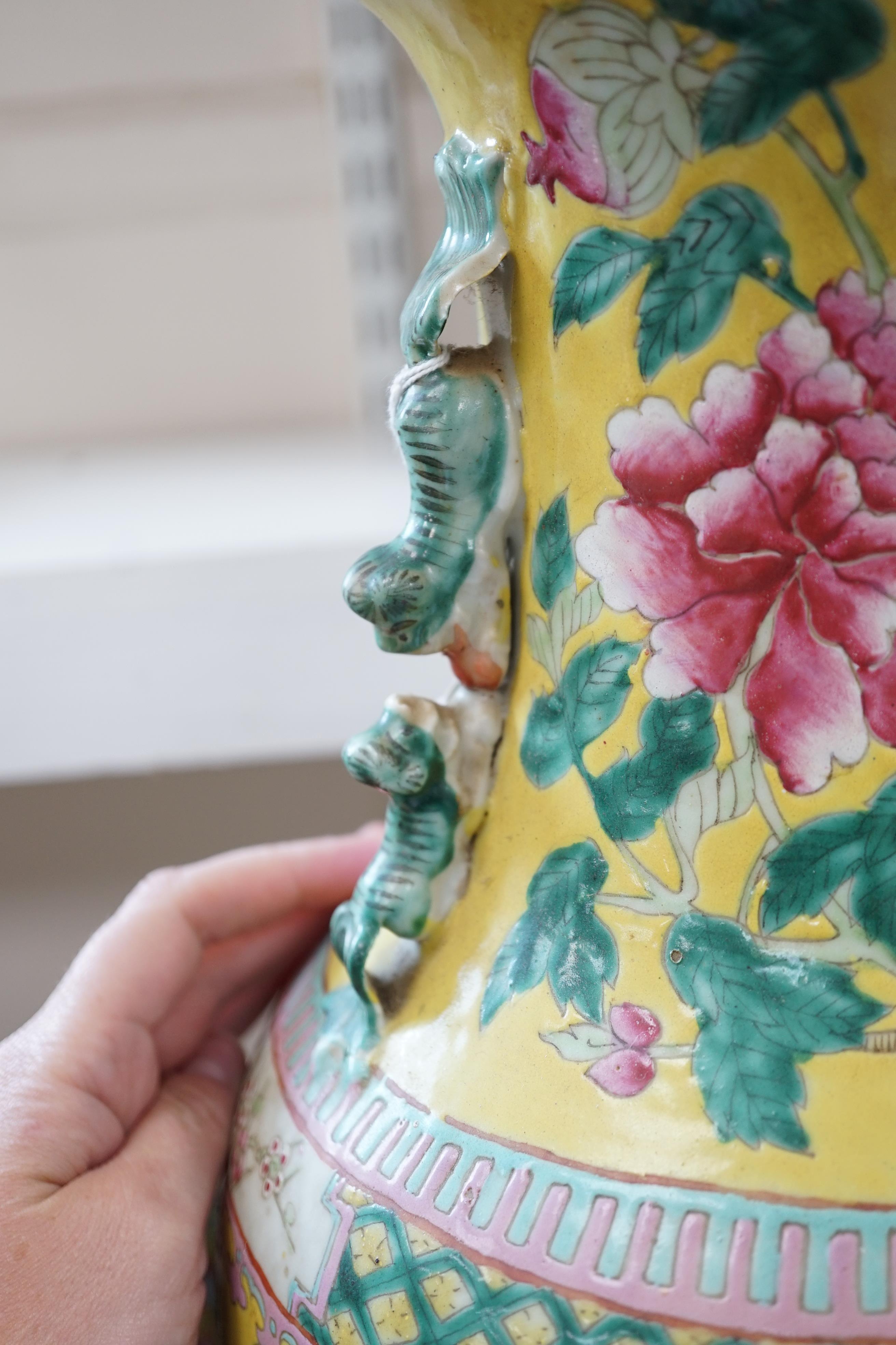 A tall Chinese Straits yellow ground ‘dragon’ vase, 19th century, rim chips